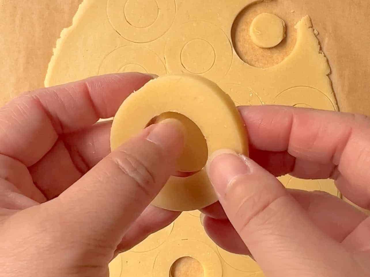 removing center of cut-out shortbread cookie
