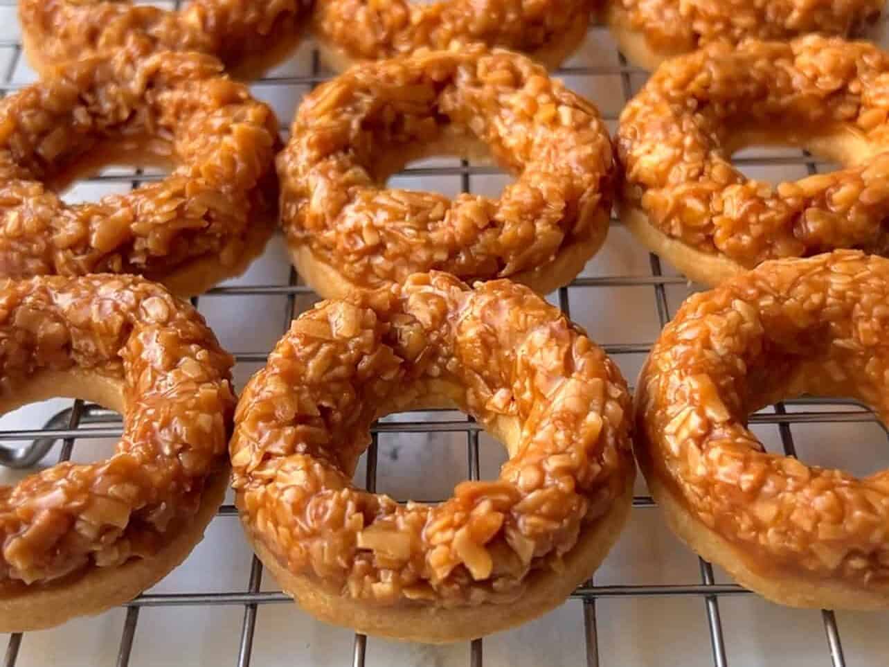 Toasted coconut and caramel mixture on shortbread cookies - Girl Scouts Copycat Samoas