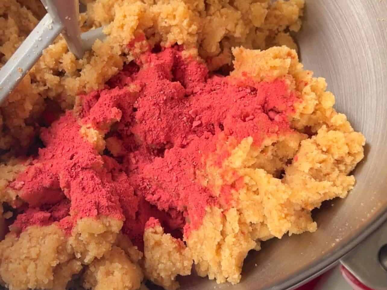 sprinkle crushed freeze dried strawberries into vanilla cake crumbles