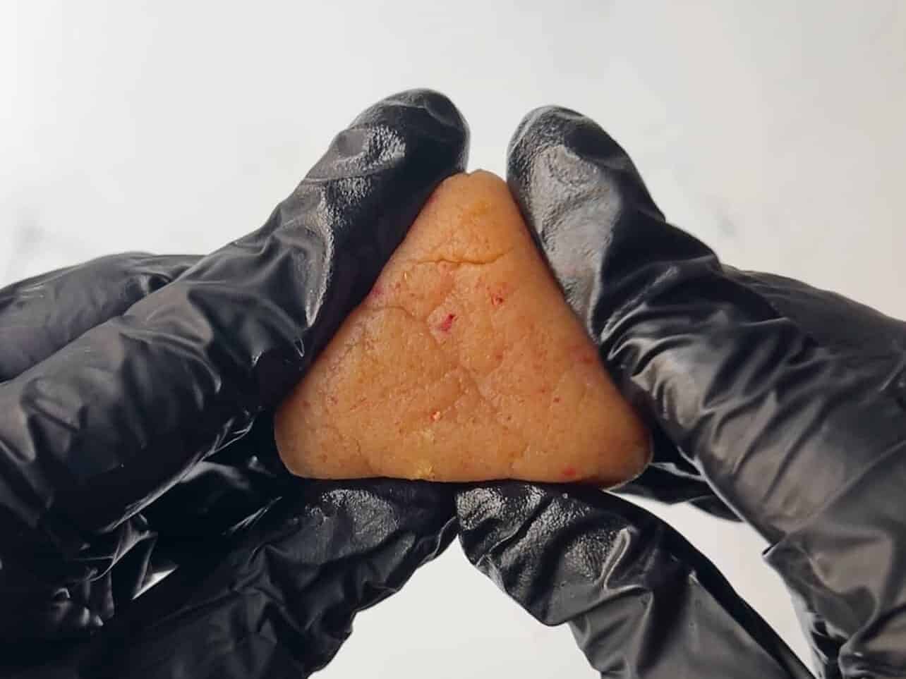 forming strawberry shapes out of cake crumbs 