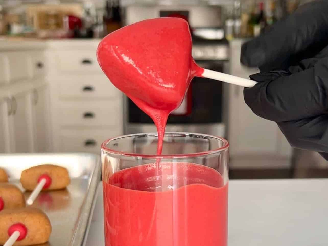 tap cake pop to allow excess coating to drip off