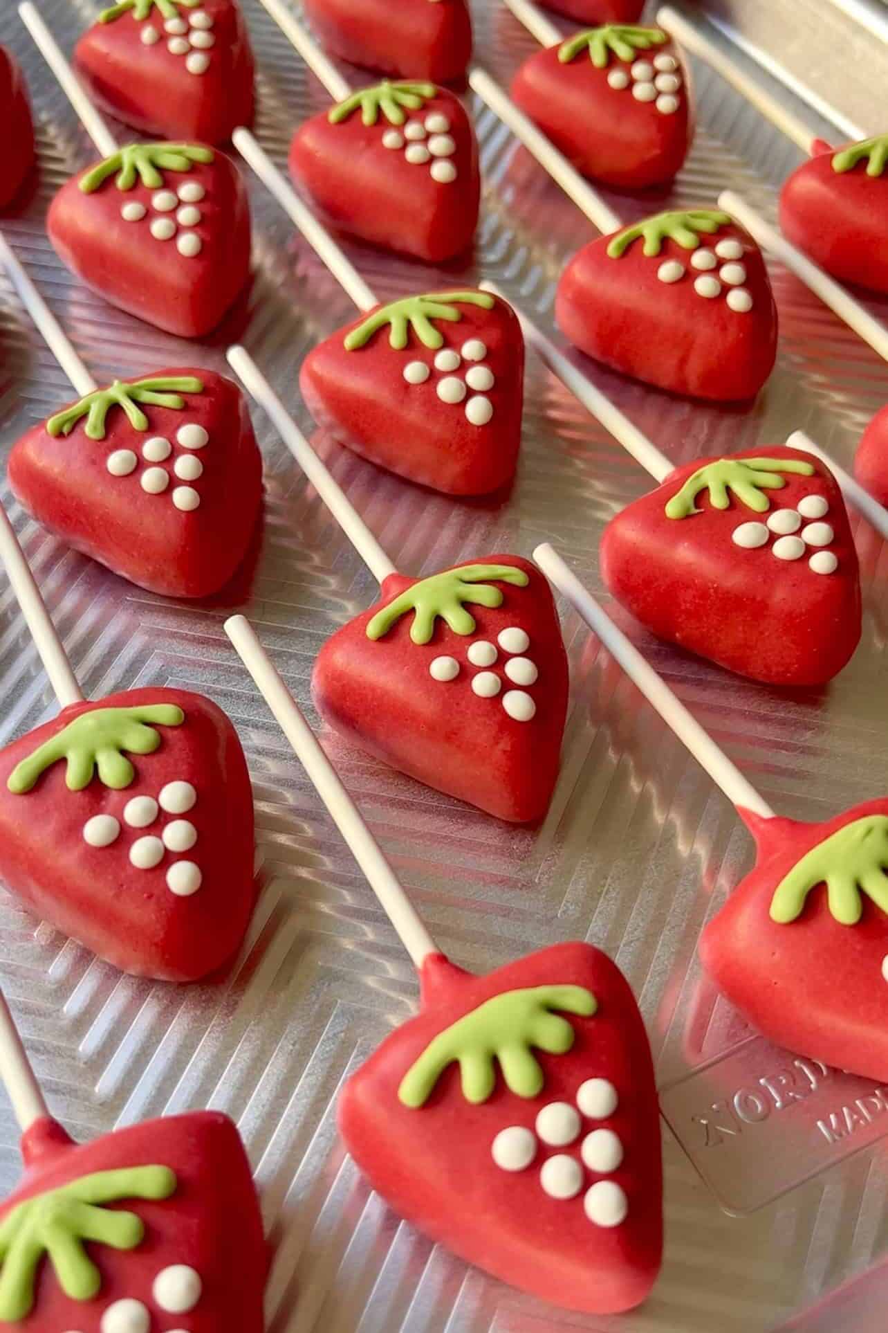 Homemade Starbucks Copycat Strawberry And Cream Cake Pops on a baking sheet