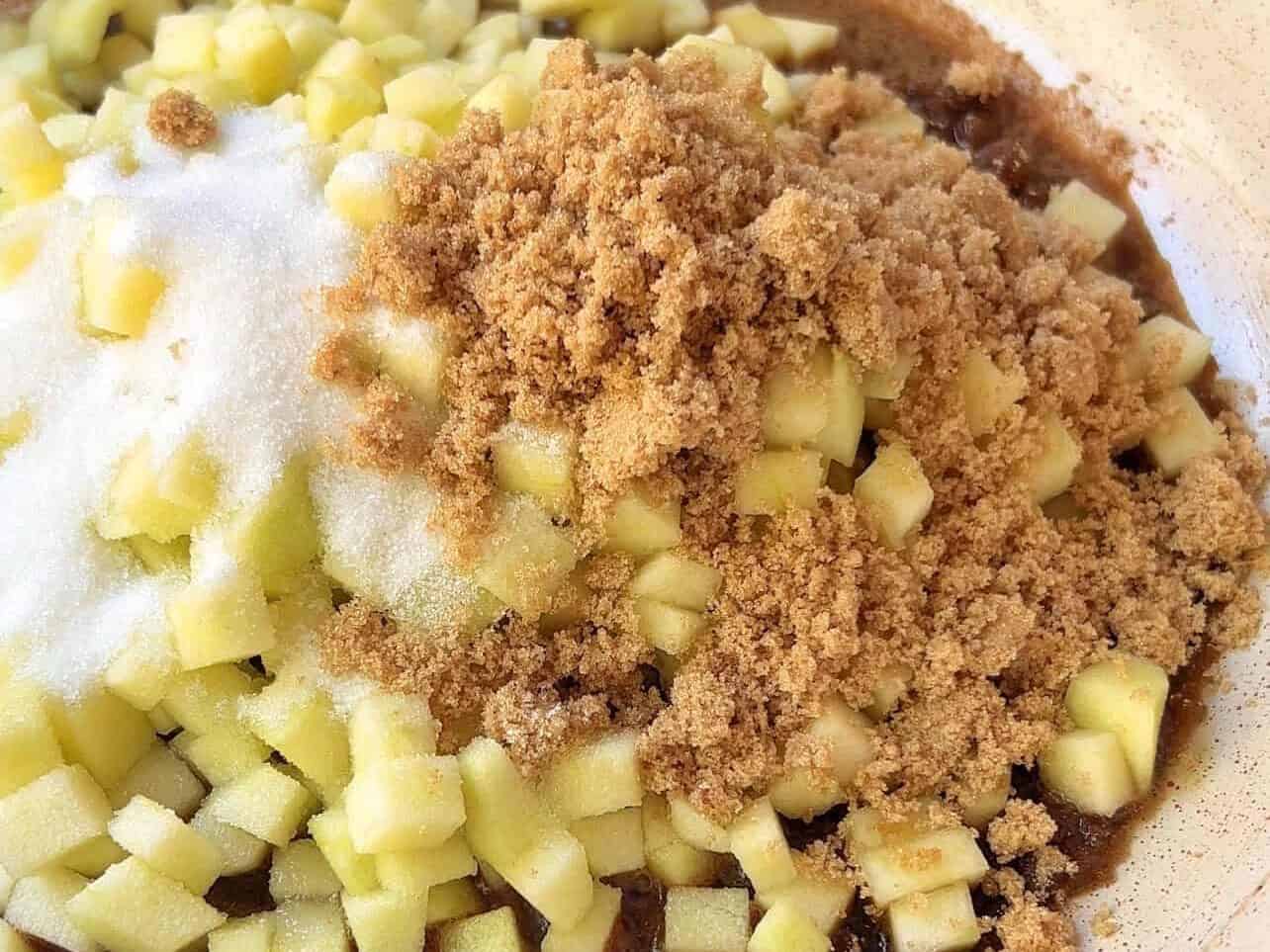 diced green apples, white and brown sugar in a skillet to make apple pie filing