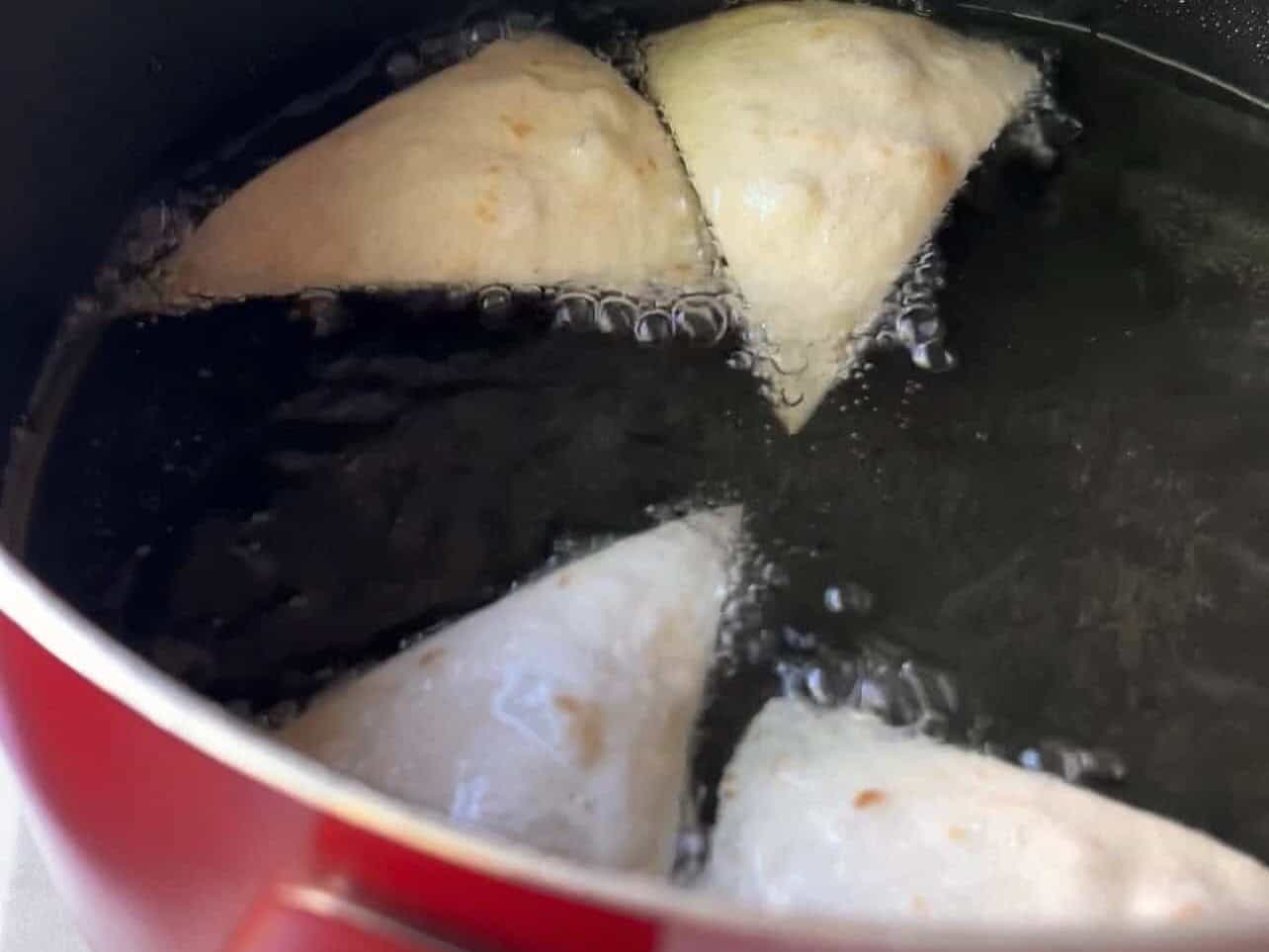 Fry tortilla chips in cooking oil
