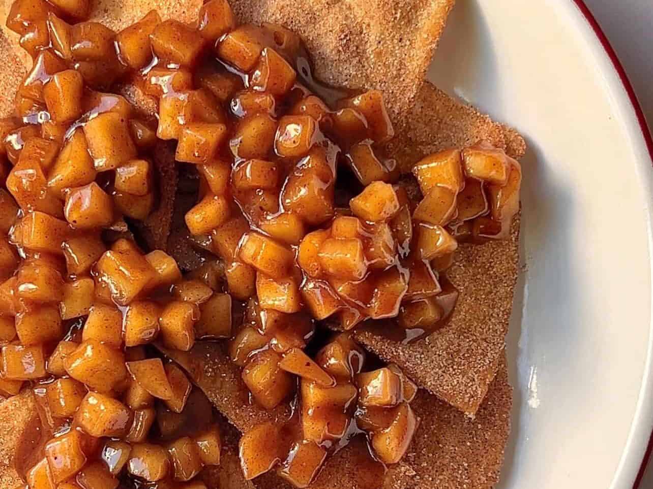 layer dusted sweet tortilla chips with apple pie filling to create apple pie nachos