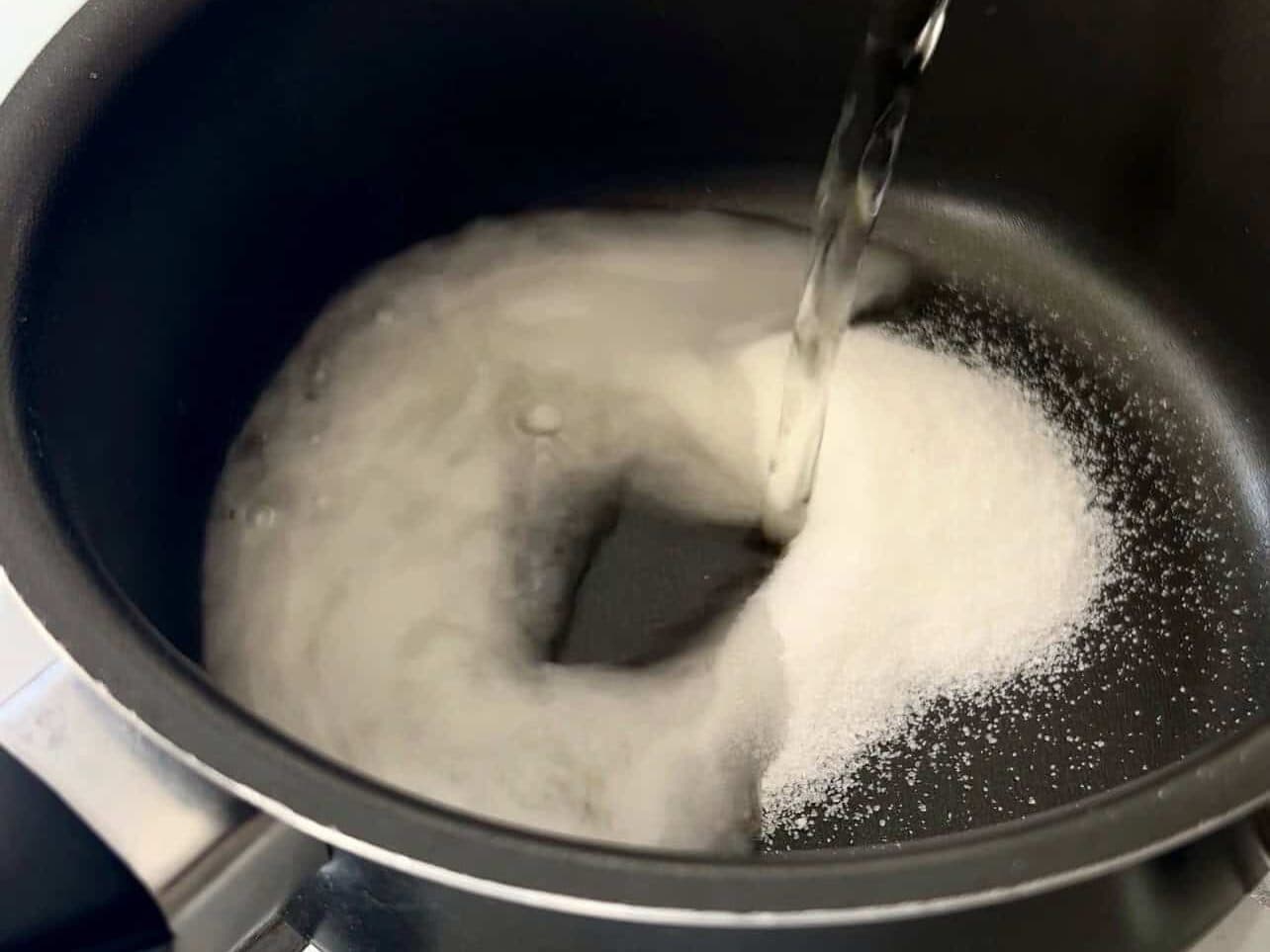 heating rice vinegar with sugar and salt to make sushi rice