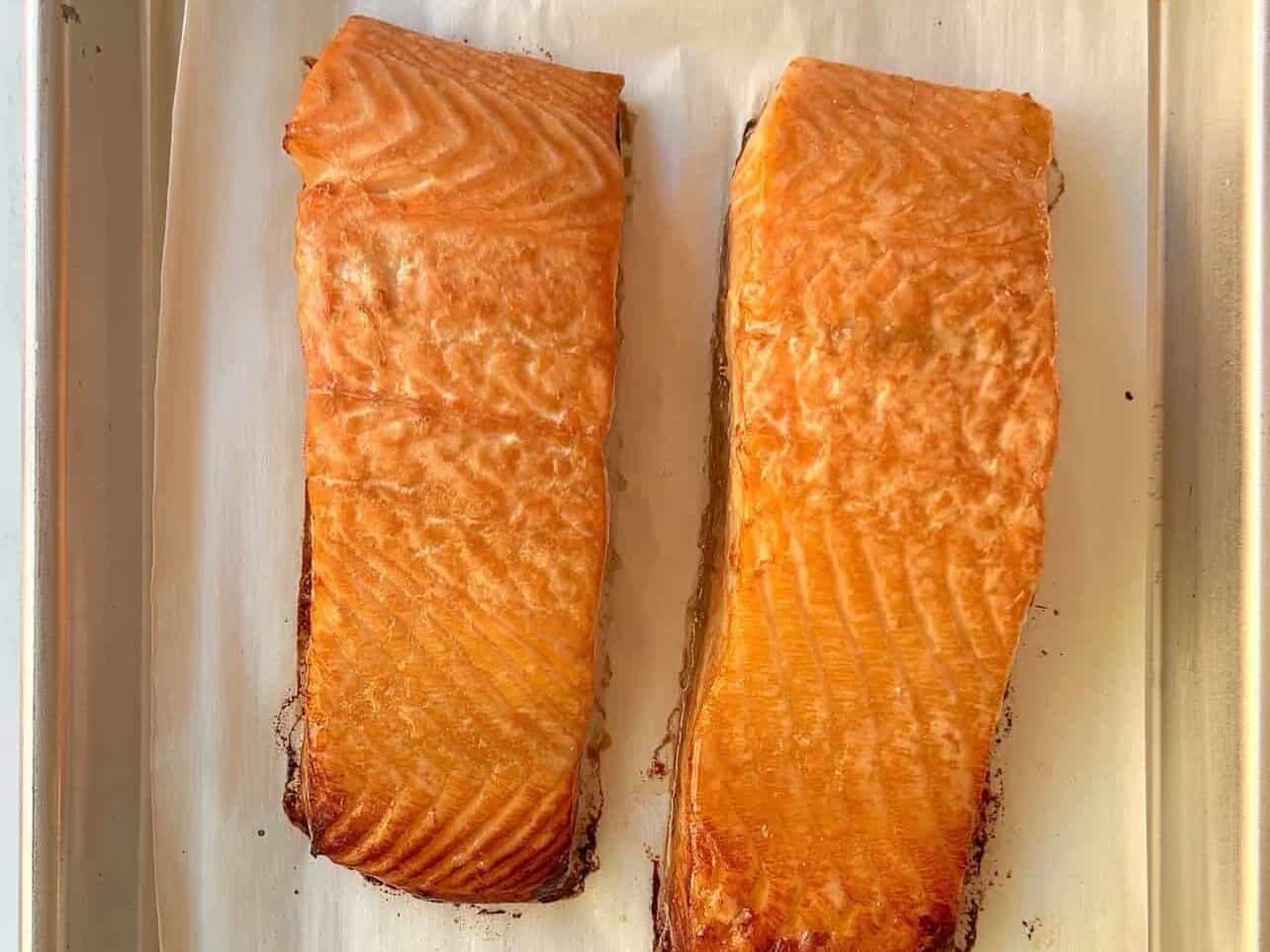 salmon cooked with a soy ginger marinade on a baking sheet