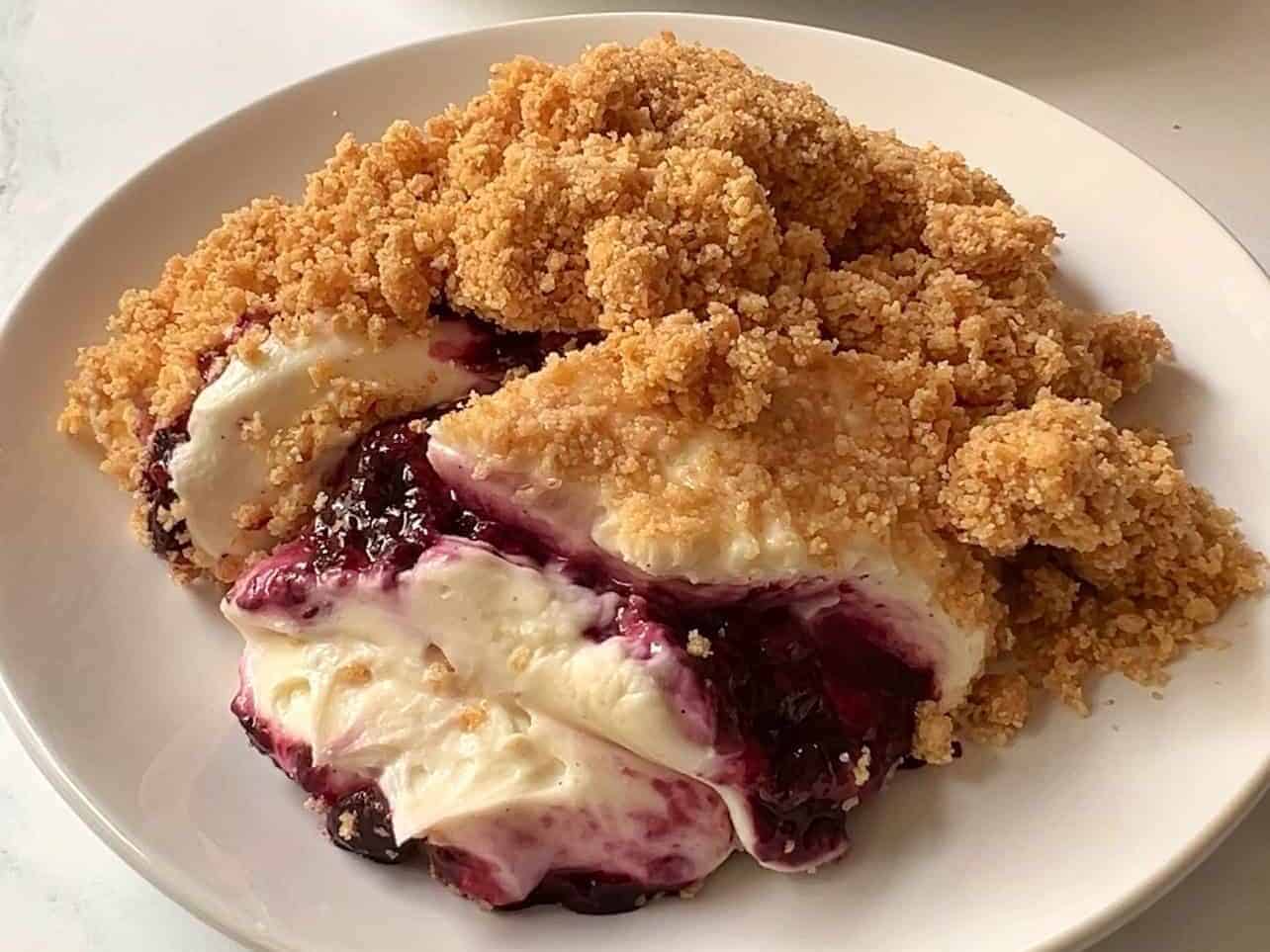 scoop of upside down cheesecake on serving plate