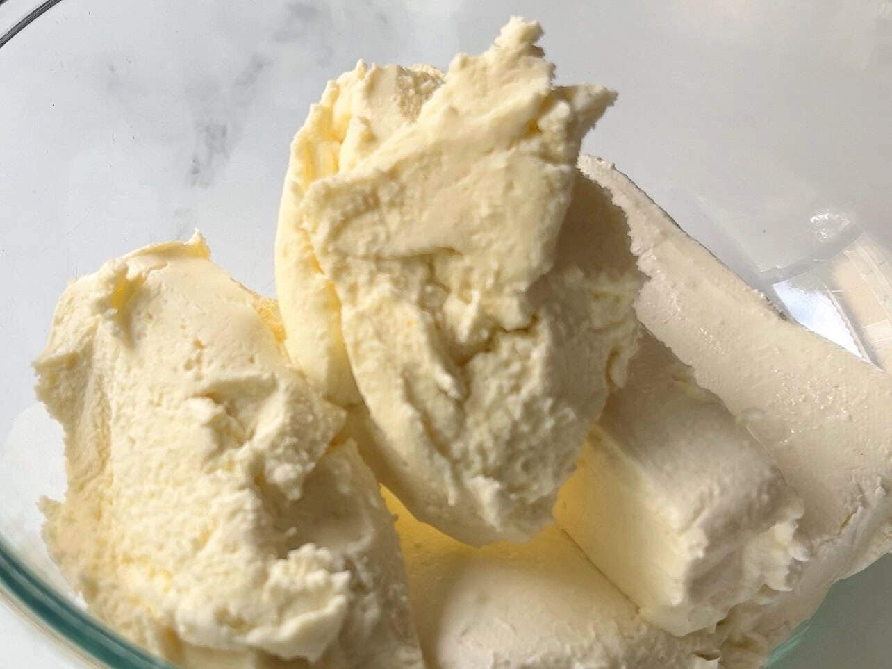 cream cheese and mascarpone cheese combined in large bowl to make cheesecake