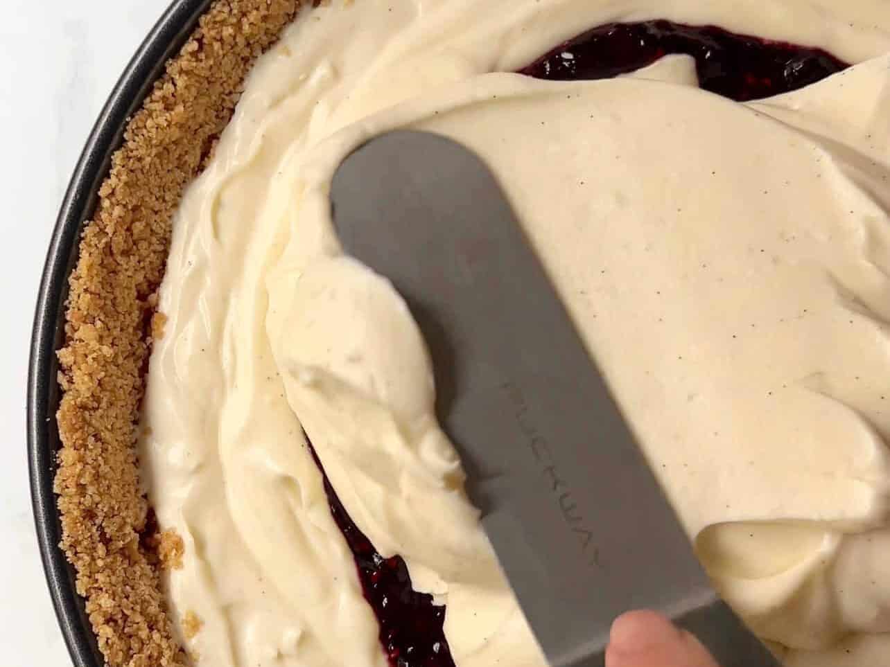 enclosing fruit compote in cennter of upside down cheesecake