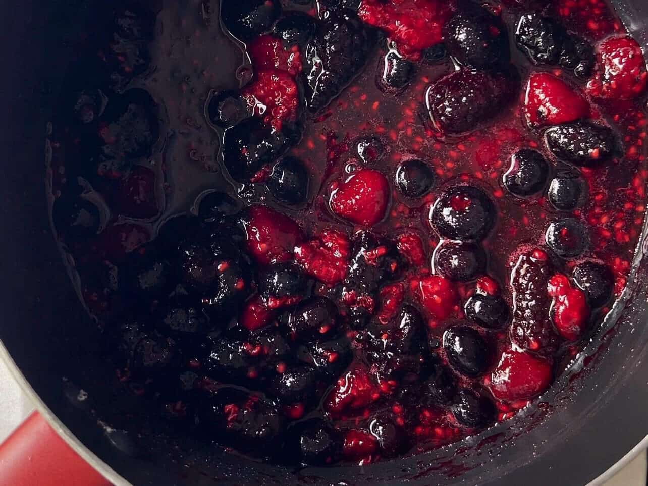 fruit compote simmering in saucepan