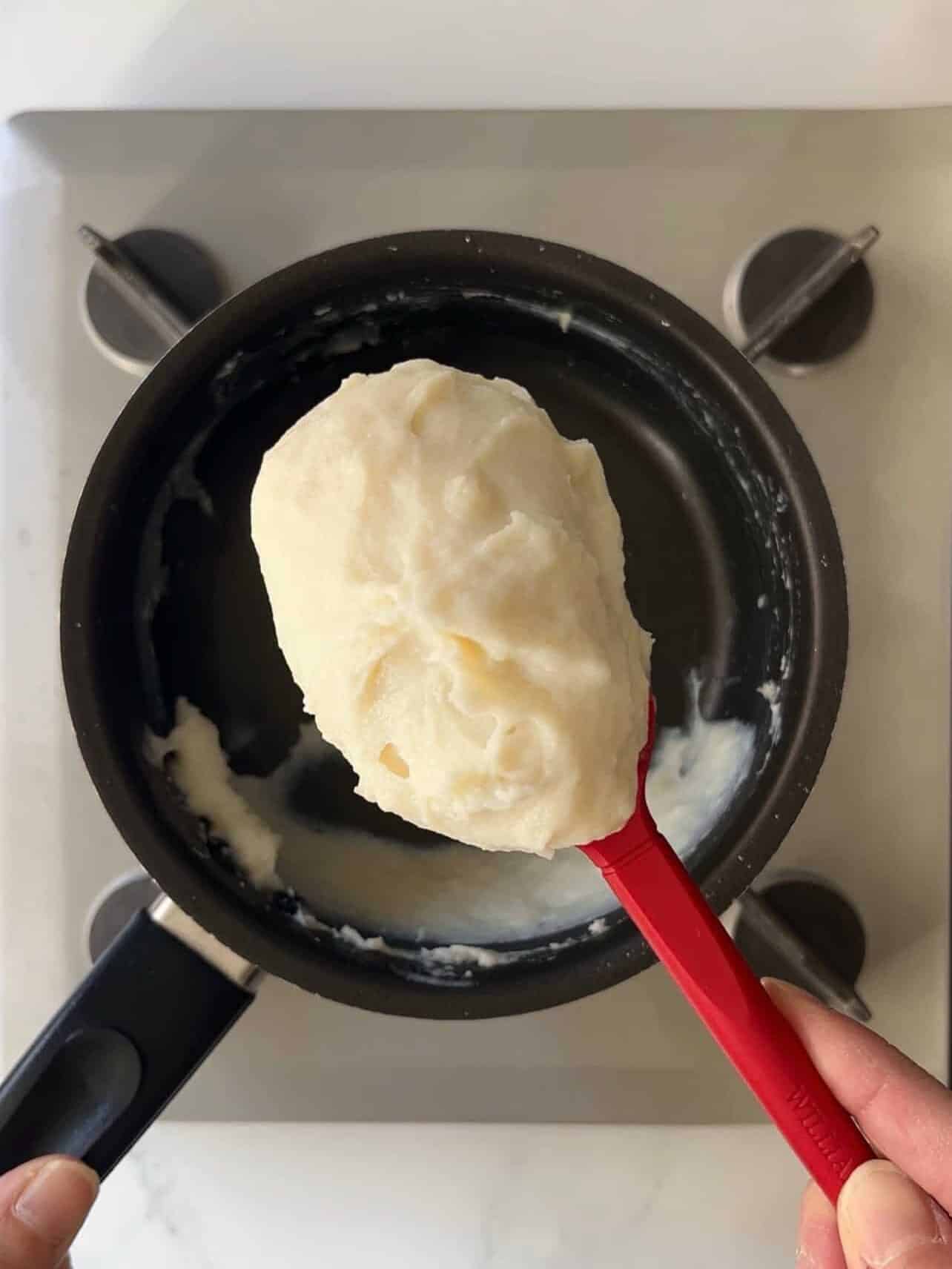 spoon close up of tangzhong paste cooked in saucepan