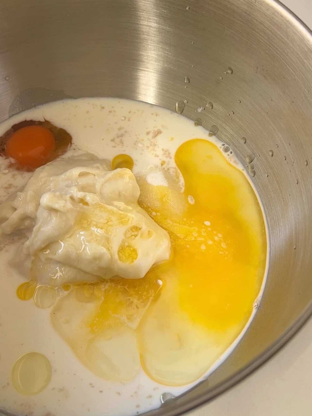 dough ingredients for Cinnabon copycat cinnamon roll in a mixing bowl