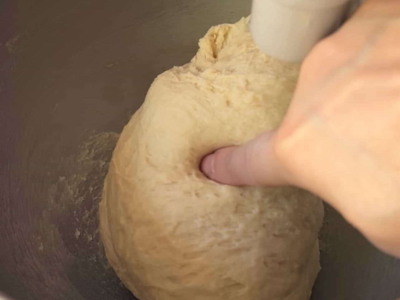 Cinnabon copycat cinnamon roll dough kneaded until tacky