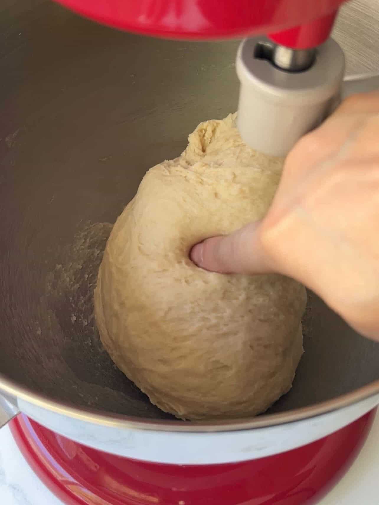 kneaded dough of Cinnabon copycat cinnamon roll tacky to the touch