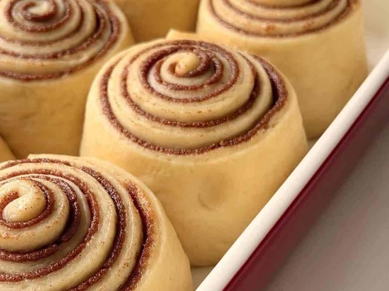 dough poke test to determine if cinnamon rolls are ready to be baked